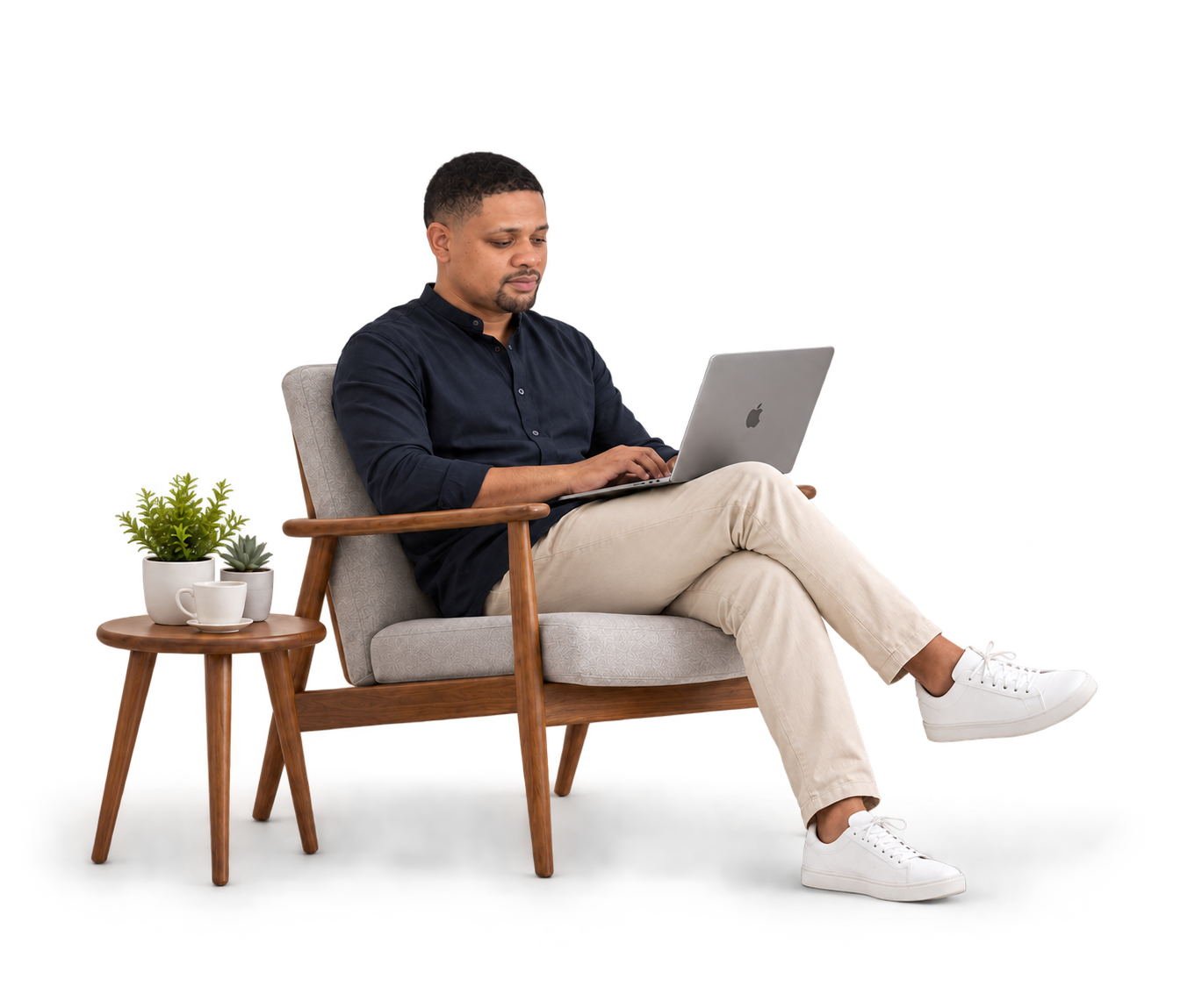 Izu Amadi seated with his laptop